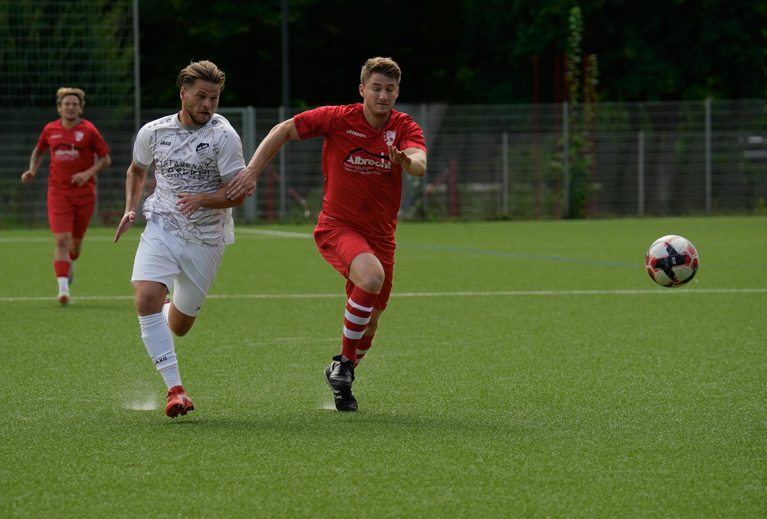 Action-packed soccer match with players running after the ball on a sunny day.
